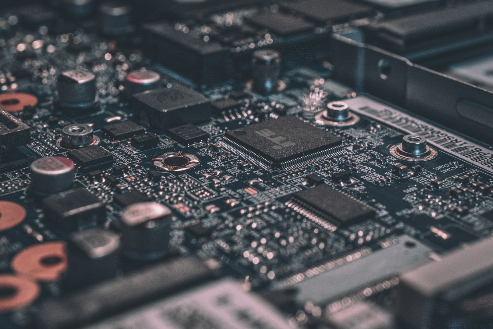 Close-up of the traces and components of a green printed circuit board